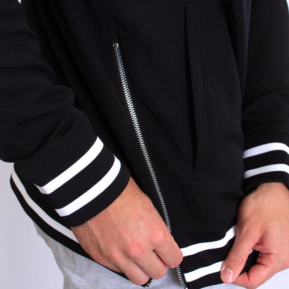Black nike jacket with white stripe hotsell